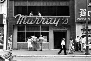 Photo from across the street (likely in front of Simpson's department store) of Murray's Restaurant near the Loews Cinema in Montreal