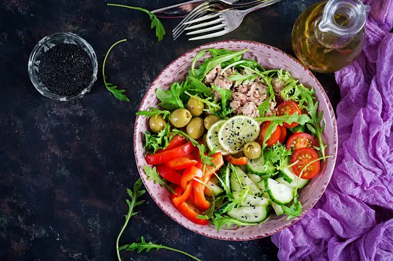 A tuna salad on a purple background