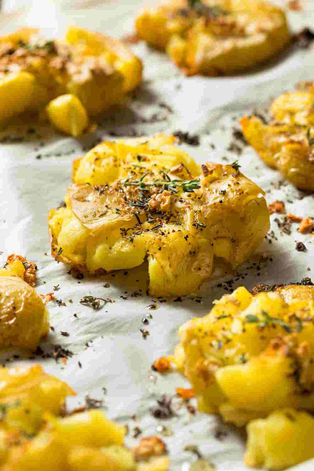 Golden, crispy smashed potatoes with herbs.