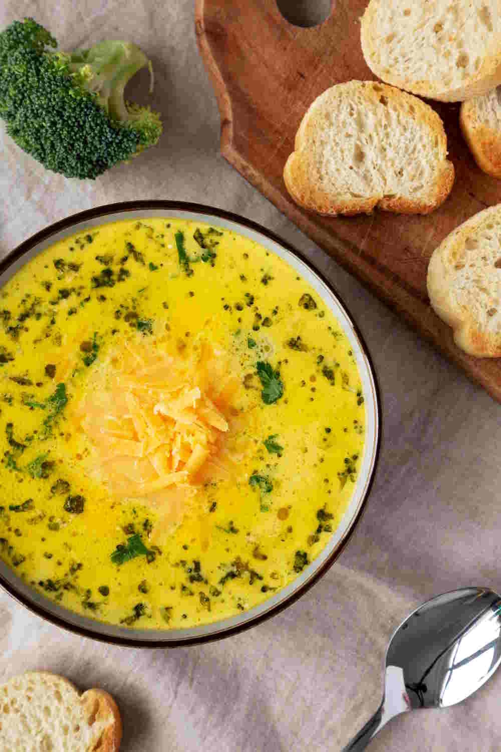 Keto broccoli cheddar soup in a Bowl, top view. Close-up.