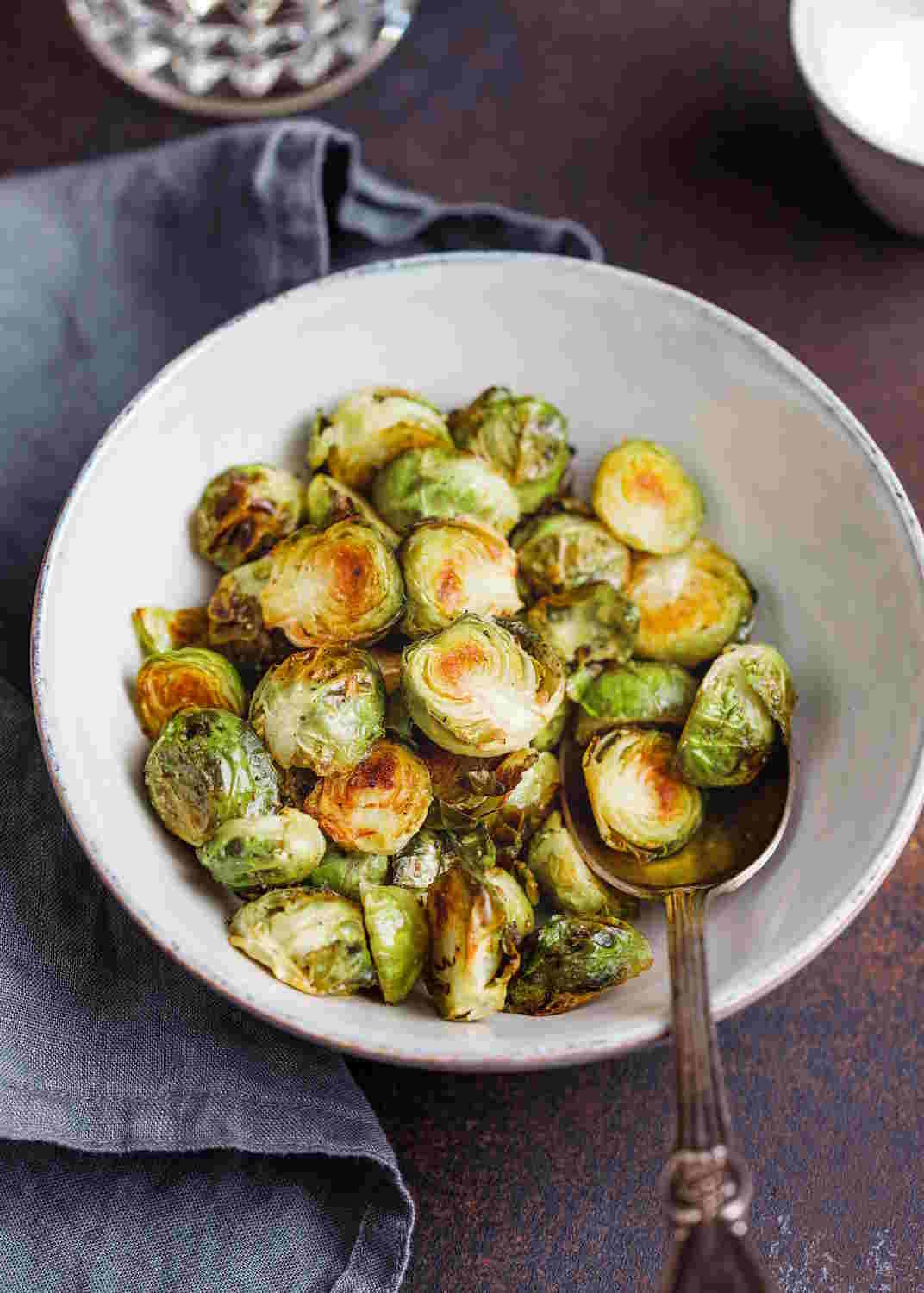 Keto Brussels Sprouts, roasted in the white bowl