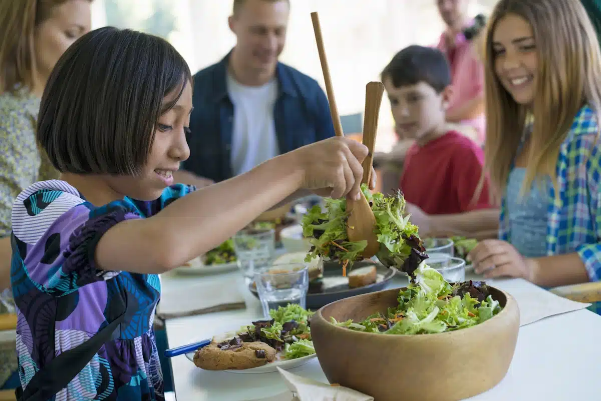 Kid-Friendly Lunch Ideas showing three children and two parents eating salad together