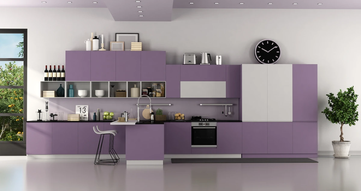 Modern purple and white modern kitchen with an assortment of kitchen equipment