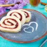 Peanut butter and jelly sushi rolls on a plate made with your niece