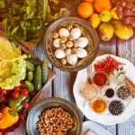 Religious Dietary Restrictions Cucumbers beside bowl of walnuts and a Plate with spices and fruits