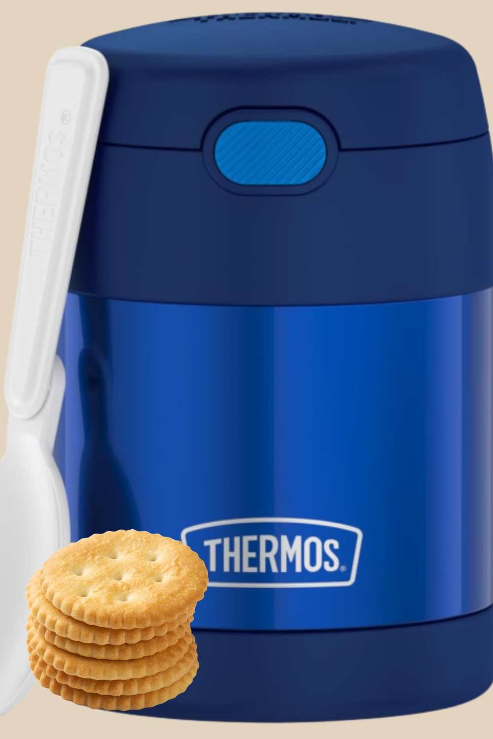 Soup inside a thermos bottle with crackers on the side
