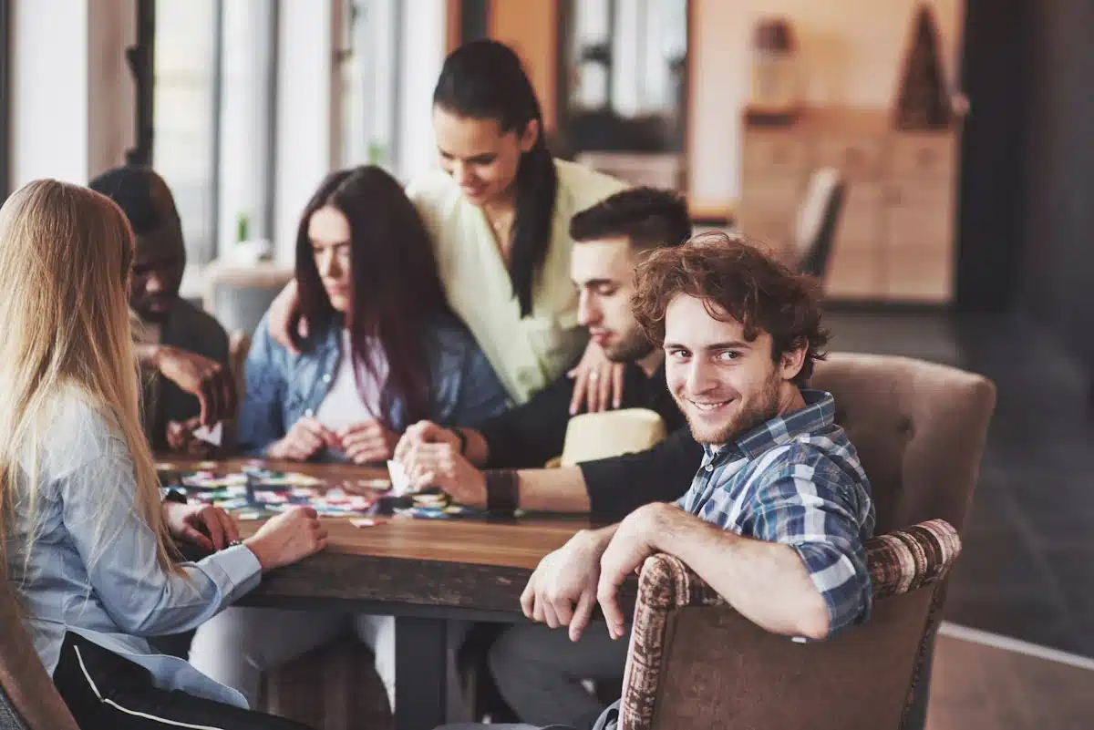 Best places for team bonding a group of people sitting around a table