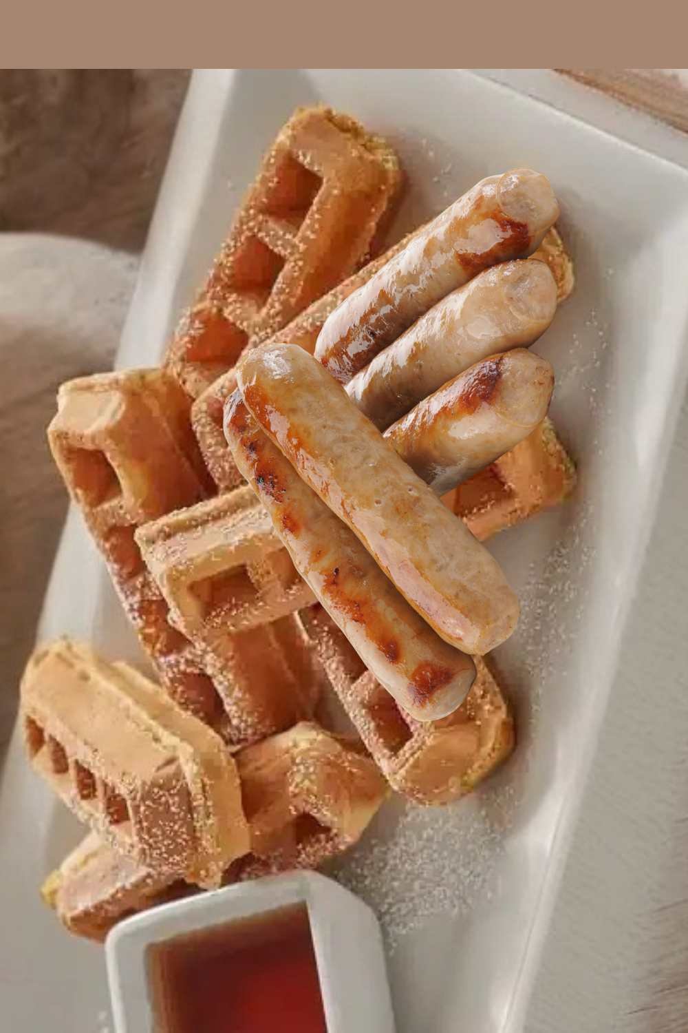 Waffles and sausages on a plate