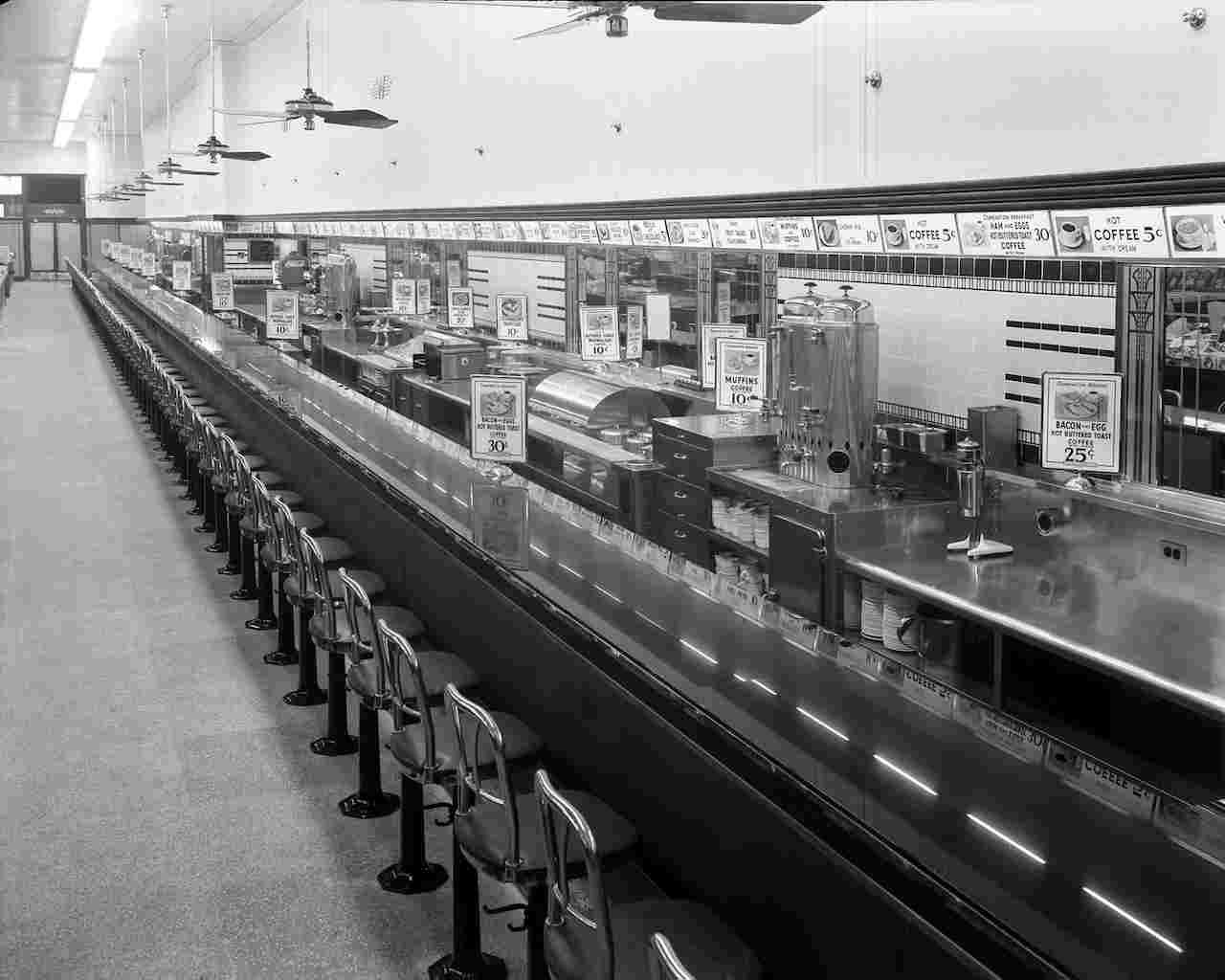 Empty Woolworth's lunch counter with stools