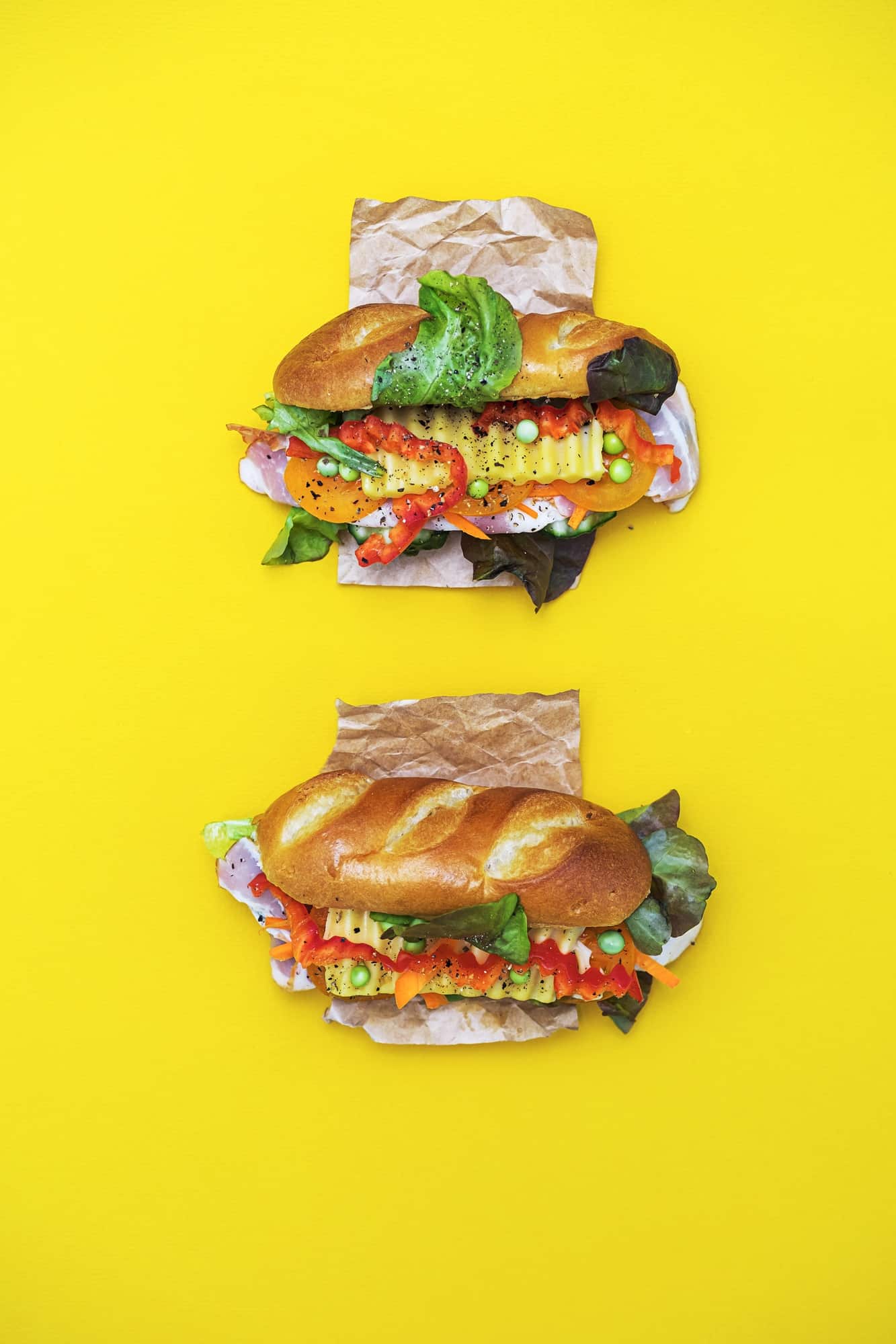 Banh Mi Vietnamese Sandwiches with Various Stuffing. Flat Lay on the Yellow Background.
