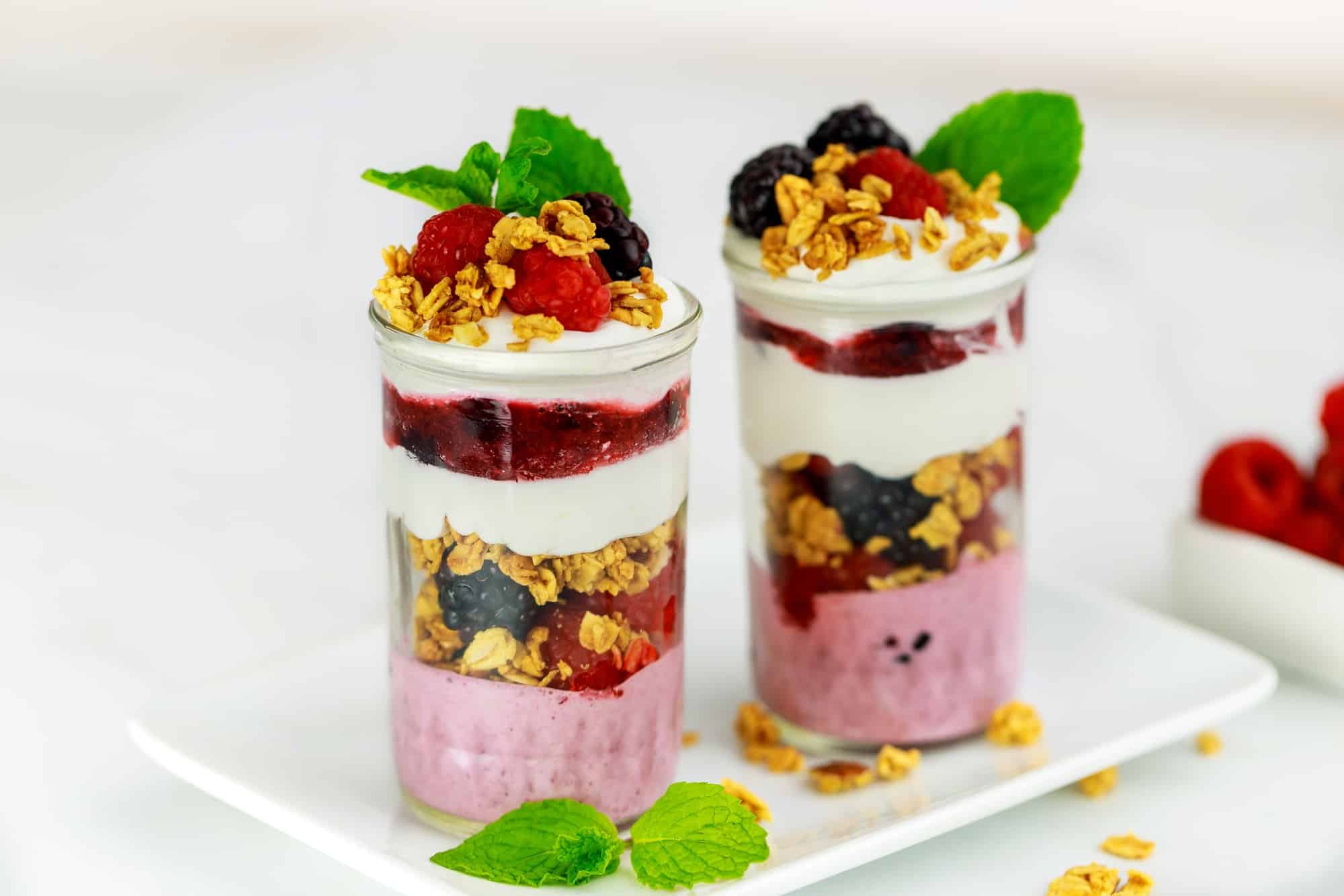 Berry dessert with mousse, granola and fresh berries. Healthy breakfast