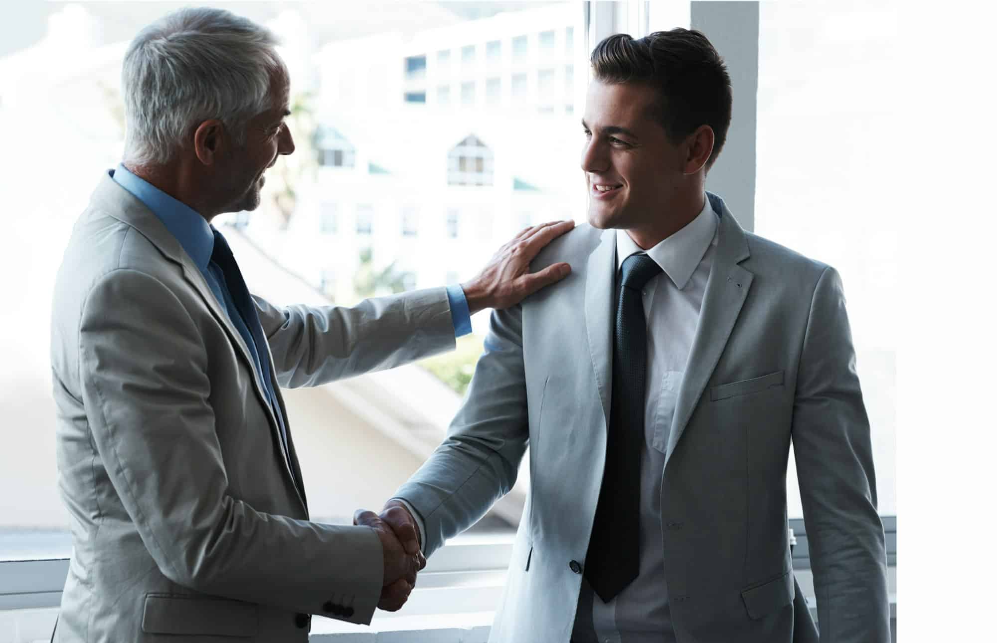Building business relationships. Two businessmen shaking hands.