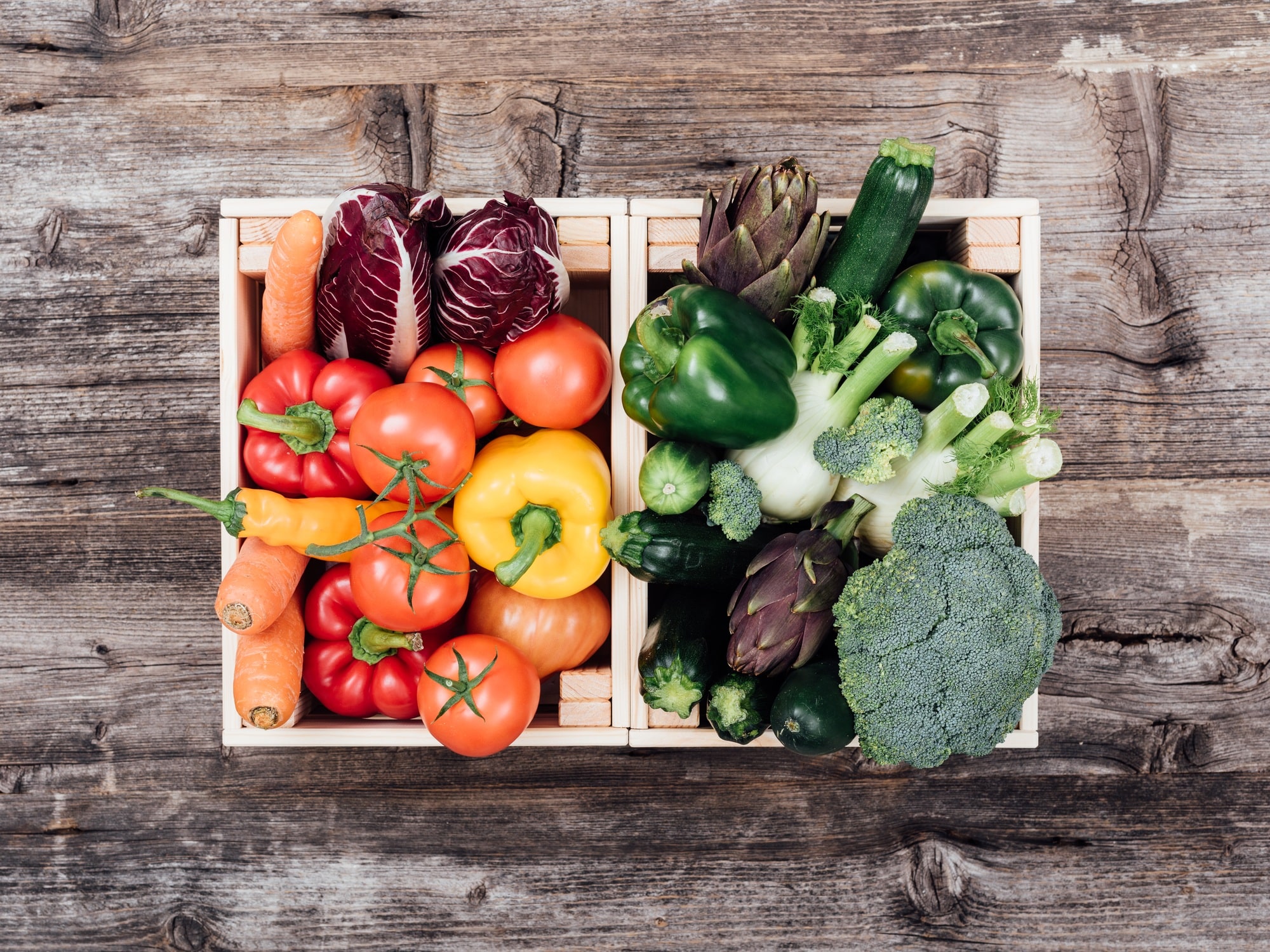 CSA sourced Fresh tasty vegetables in wooden crates