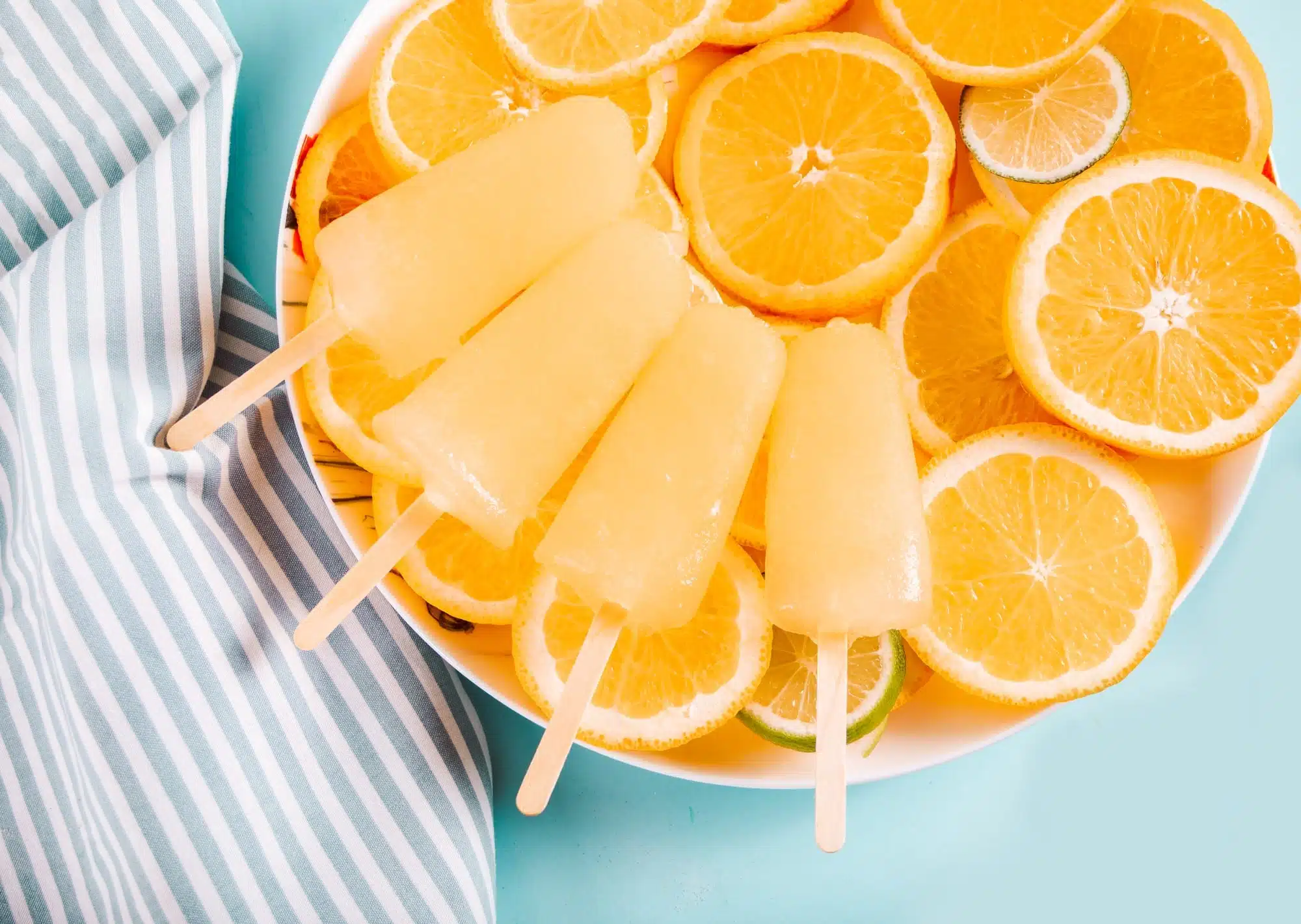 Summer Dessert Recipes | 10 Light &Amp; Easy Ideas 11 Fruit orange citrus ice pops and slices of orange, top view