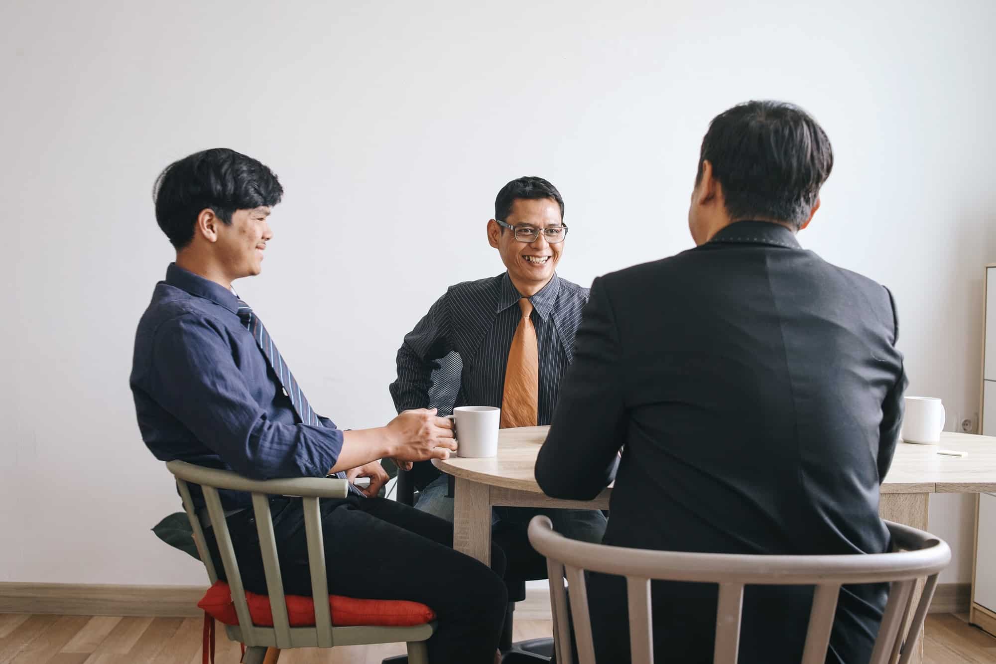 Group of Businessman Having Conversation During Break