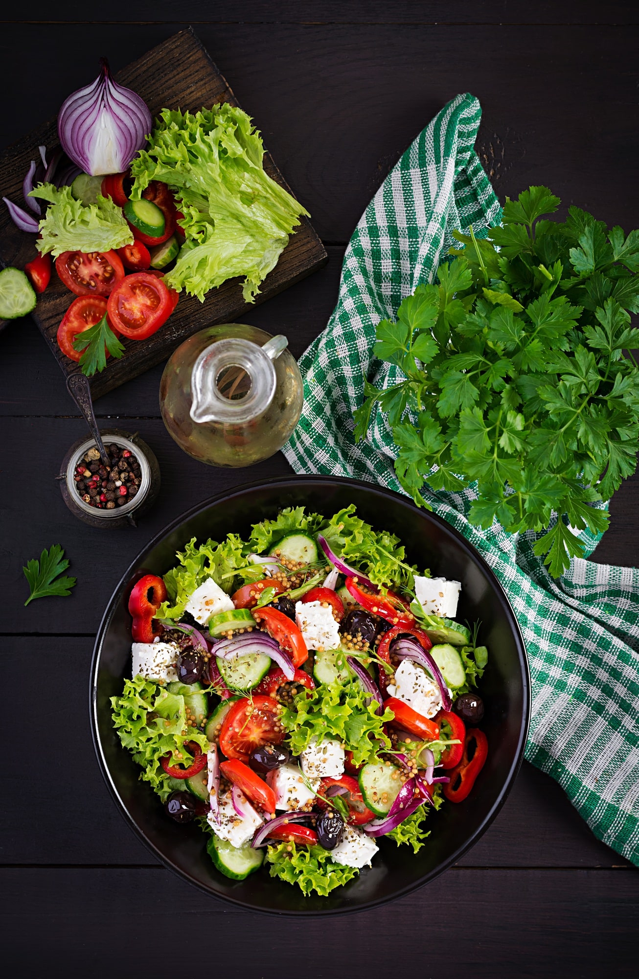 Healthy food. Greek salad with cucumber, tomato, sweet pepper, lettuce, red onion, feta cheese