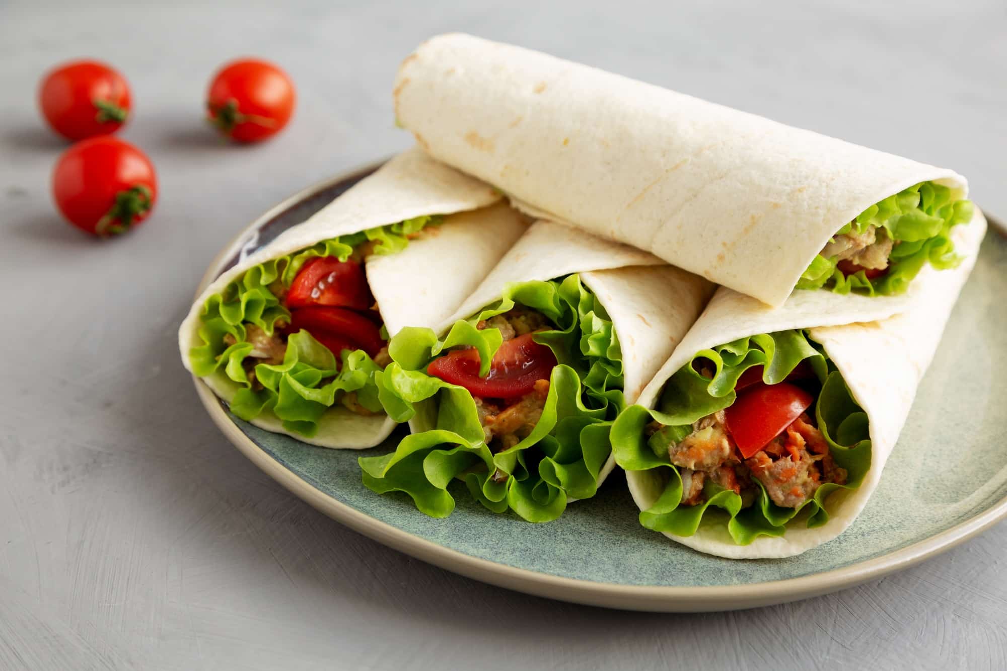 Homemade Avocado Tuna Wraps on a Plate , side view.