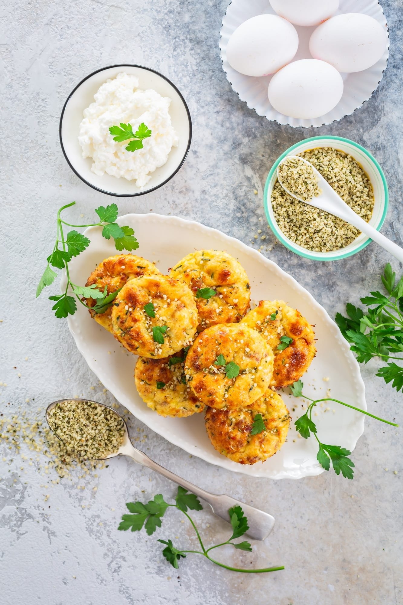 Hidden Veggie Muffins for Picky Eaters: Healthy Lunch Box Idea 1 Homemade egg and zucchini muffins with feta cheese, savory courgette with ingredients