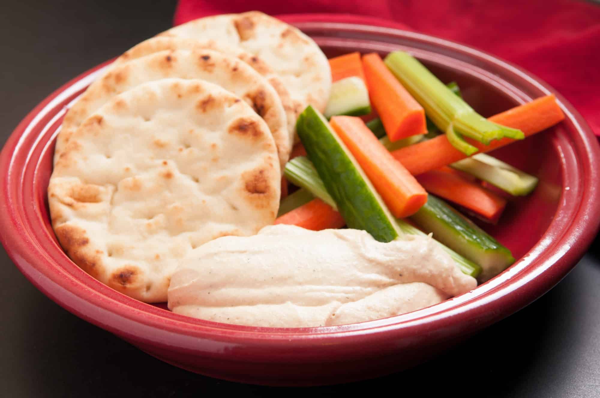 hummus with vegetable sticks and naan