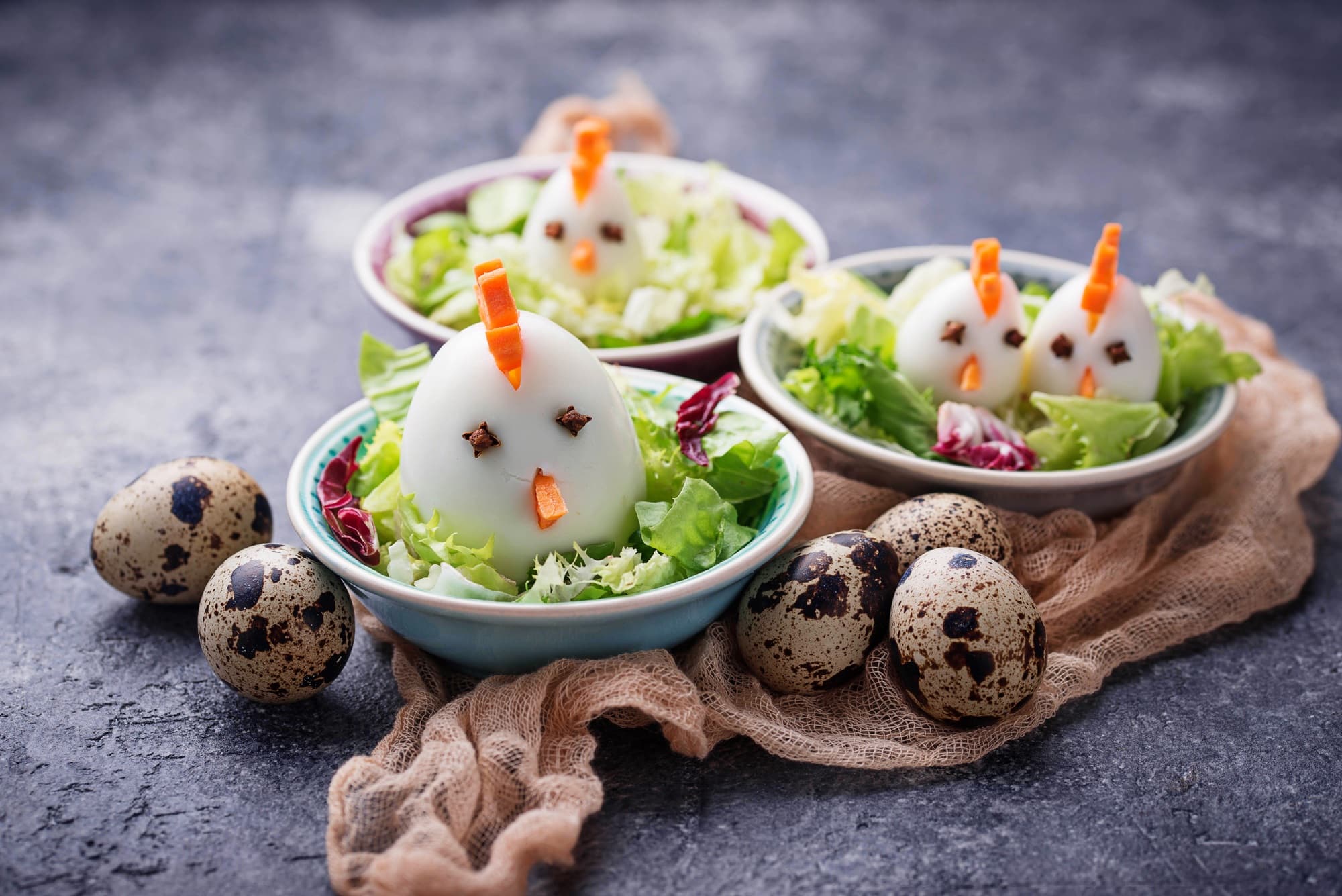 Salad with eggs in shape of chickens. Festive food.