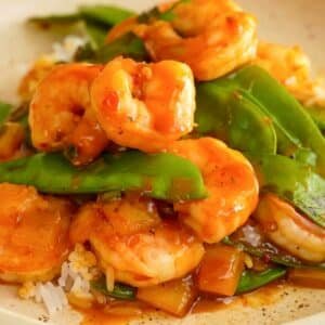 Stir fry shrimp on plate. Homemade fresh fried seafood shrimp, green peas for restaurant, menu, adve