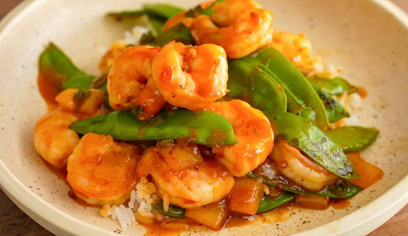 Stir fry shrimp on plate. Homemade fresh fried seafood shrimp, green peas for restaurant, menu, adve