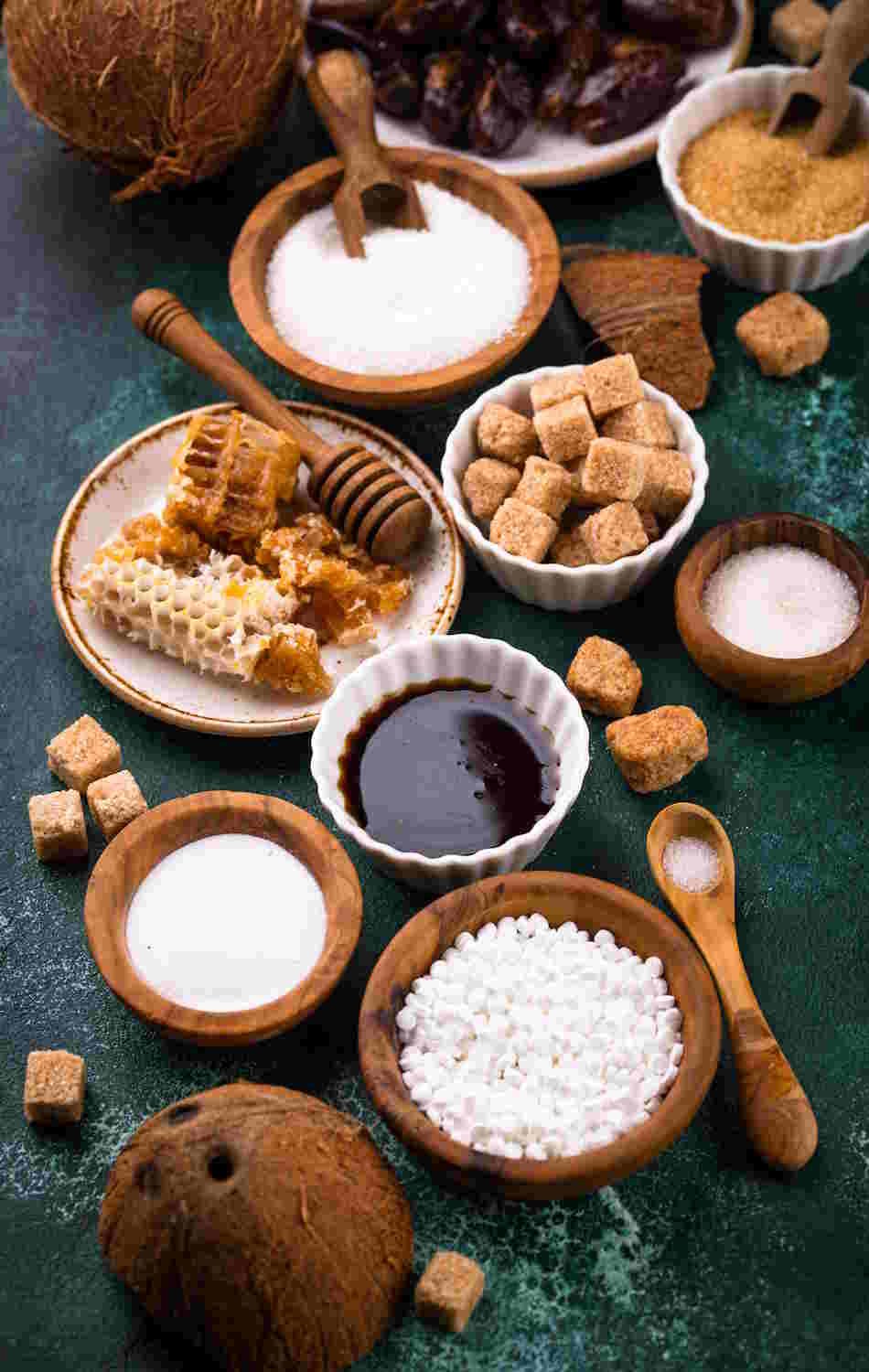 sugar substitutes for baking | Variety of natural sweeteners displayed artistically.