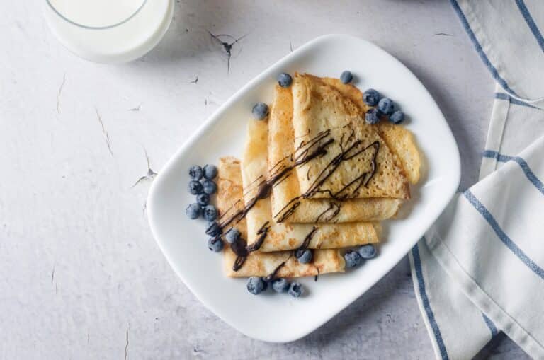 Naleśniki, which are thin homemade pancakes with berries, traditional Polish cuisine.