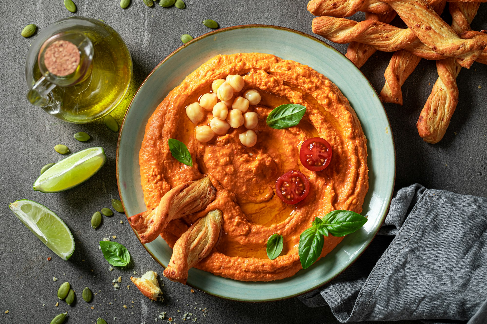 Traditional tomato hummus as red and healthy snack